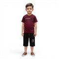 Mini & Mama boys burgundy cotton t-shirt with graphic detail and black shorts with drawstring elastic waist.