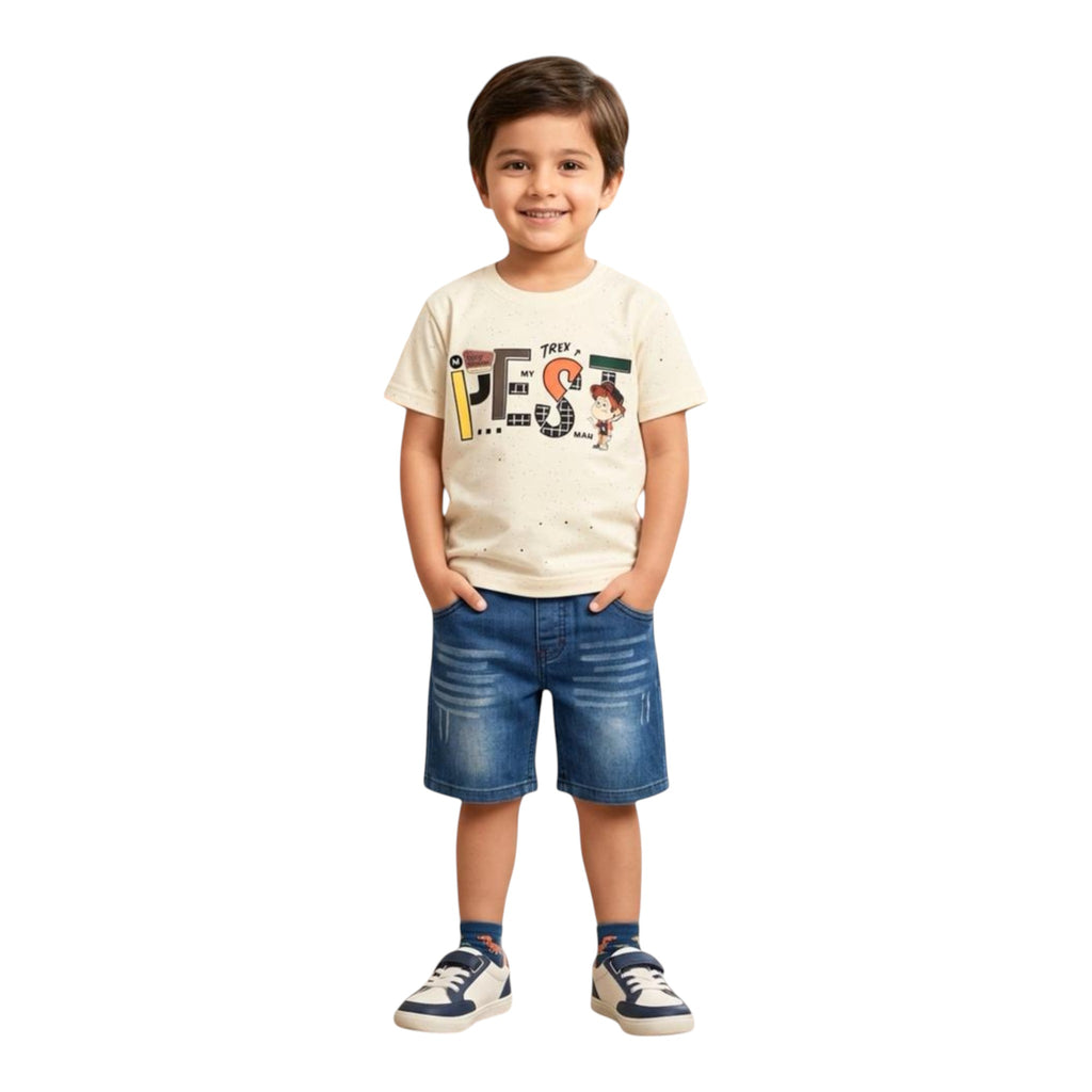 Mini & Mama boys' cream graphic t-shirt with text and cartoon print, paired with blue denim shorts. Cotton tee.