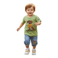 Mini & Mama boys olive green graphic t-shirt with character and "ARCHIVE" text, paired with blue denim shorts with drawstring waist and striped cuffs.