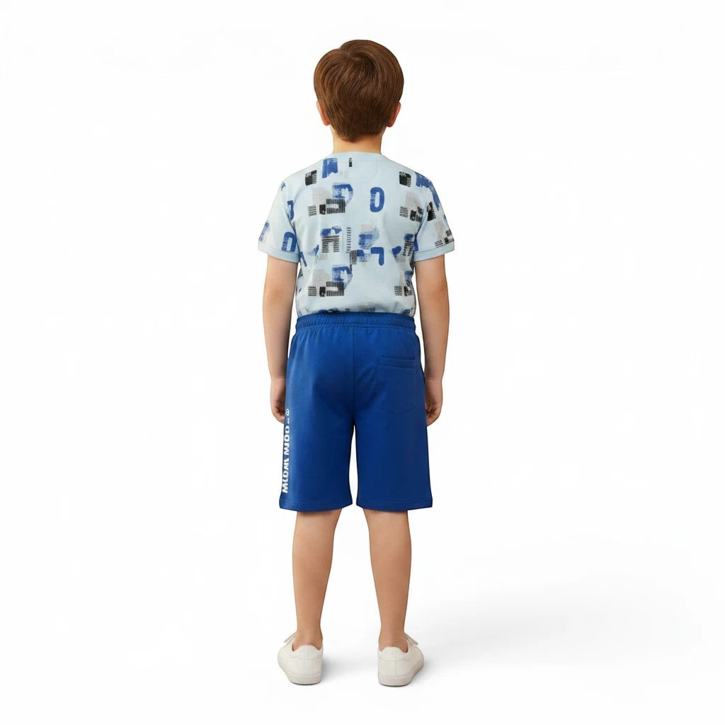 Mini & Mama boys' light blue graphic t-shirt with abstract shapes and lettering, paired with royal blue shorts. Cotton blend.