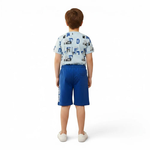 Mini & Mama boys' light blue graphic t-shirt with abstract shapes and lettering, paired with royal blue shorts. Cotton blend.
