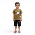 Mini & Mama olive green cotton t-shirt with turtle graphic and black shorts set for boys.