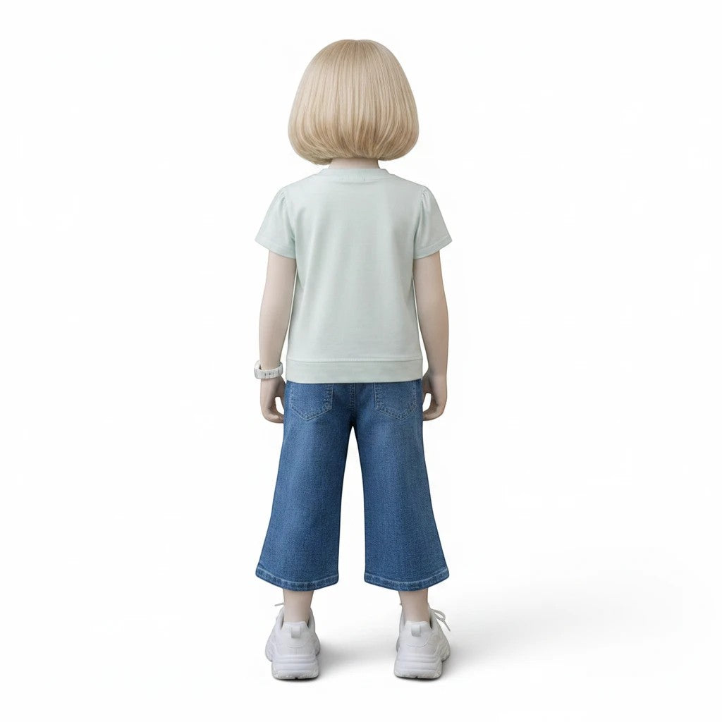 Mini & Mama Girls blue denim cropped wide leg jeans with bow accents and pearl embellishments.