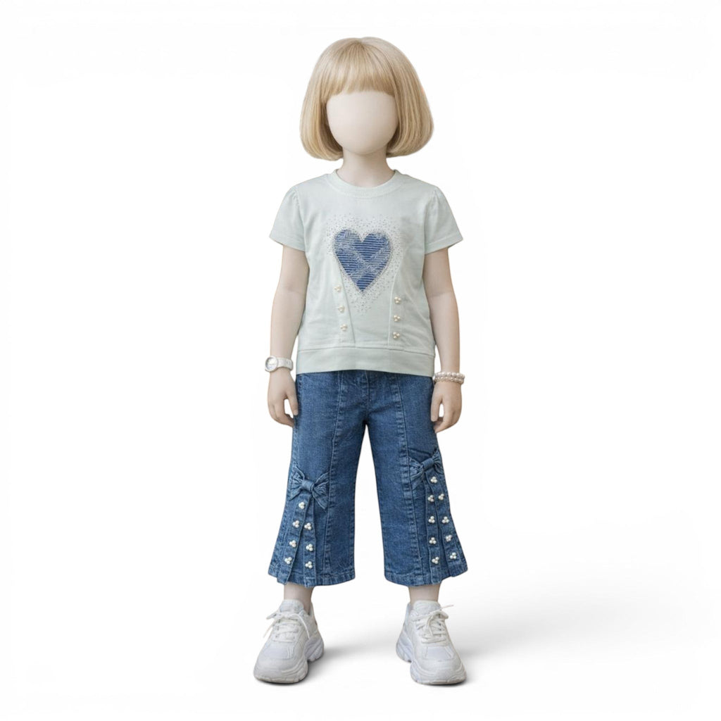 Mini & Mama Girls blue denim cropped wide leg jeans with bow and pearl embellishments on the hem.
