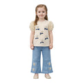 Mini & Mama cream puff sleeve top with embroidered hearts and blue bows, paired with light wash wide leg jeans embellished with hearts.