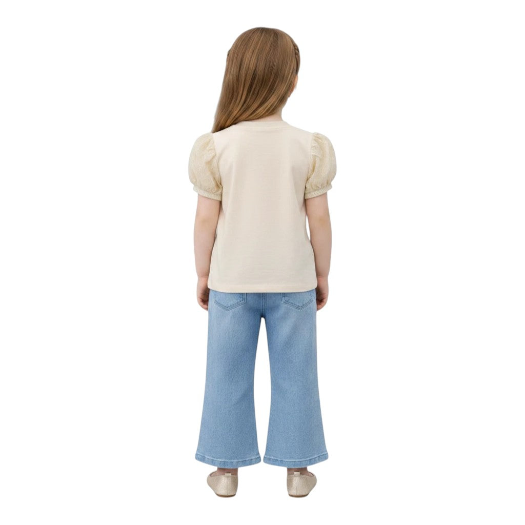 Mini & Mama cream puff sleeve top with sheer textured sleeves and embroidered hearts, paired with light wash wide-leg jeans.