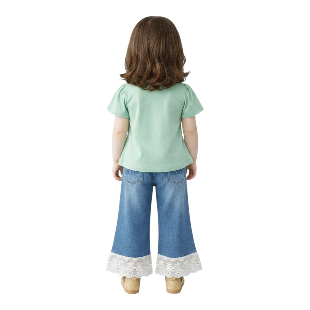 Mini & Mama Girls mint green graphic tee with puff sleeves and wide leg jeans with white lace trim.