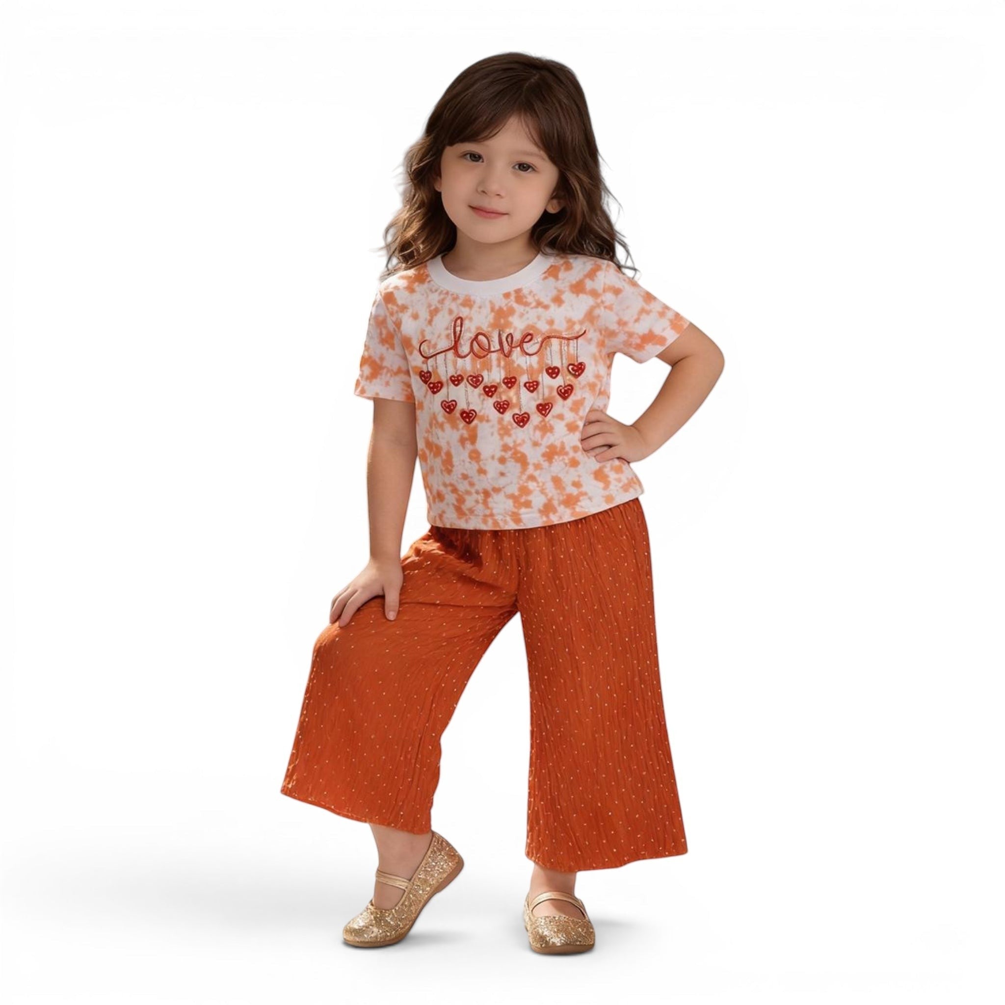 Mini & Mama Girls tie-dye t-shirt with "love" graphic and heart details, paired with orange dobby dot wide-leg pants.