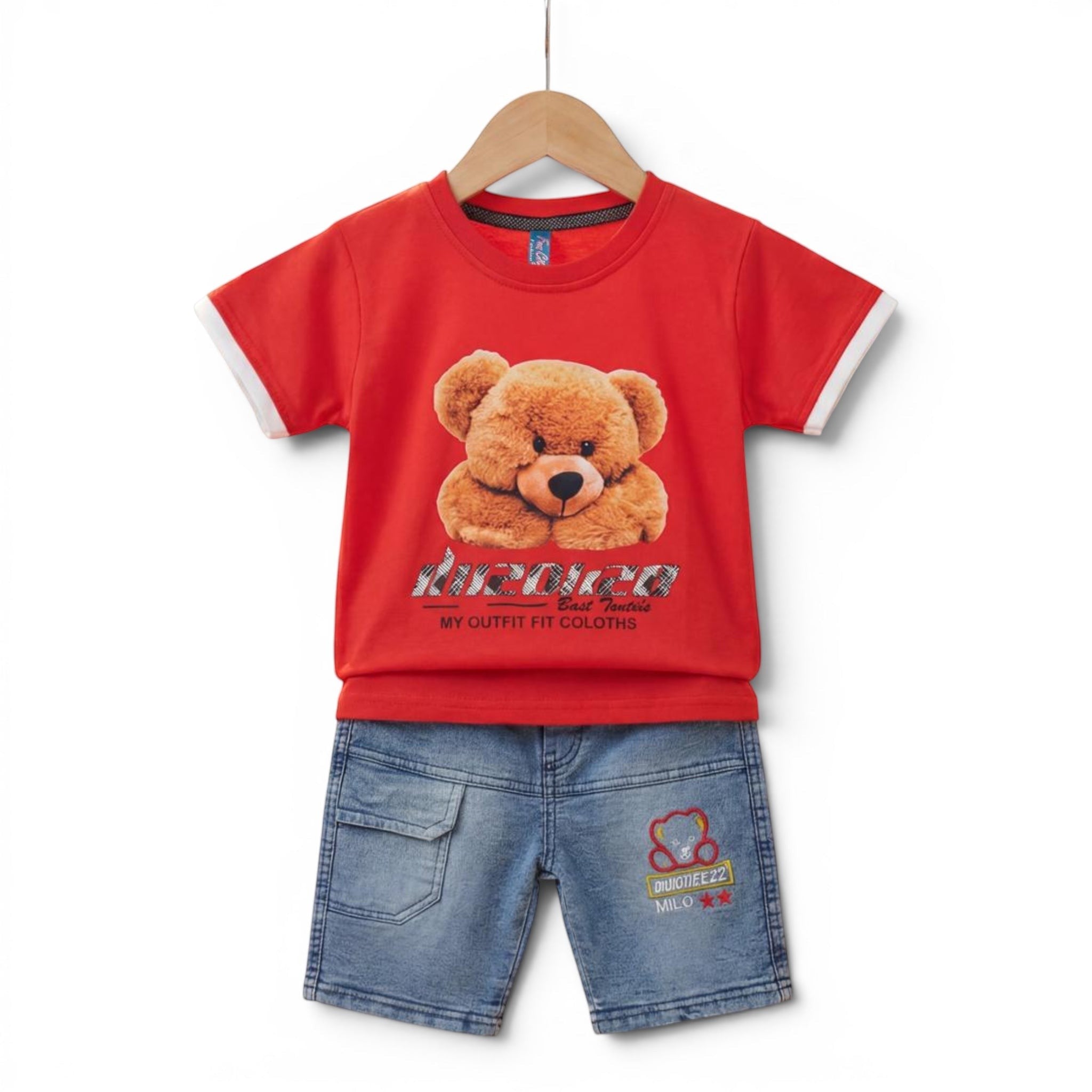 Mini & Mama Toddler Boys red t-shirt with teddy bear graphic and white trim, paired with light-wash denim shorts.
