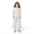 Mini & Mama white ruffled two-piece outfit set with sparkling embellishment and wide-leg pants.