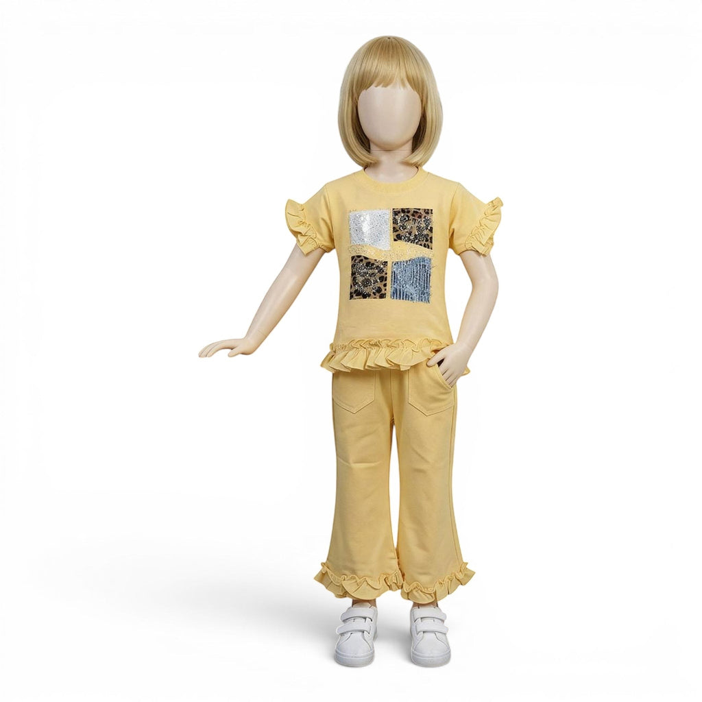 Mini & Mama yellow cotton patchwork top with ruffle sleeves and matching flare pants with ruffle hem. Girls outfit.