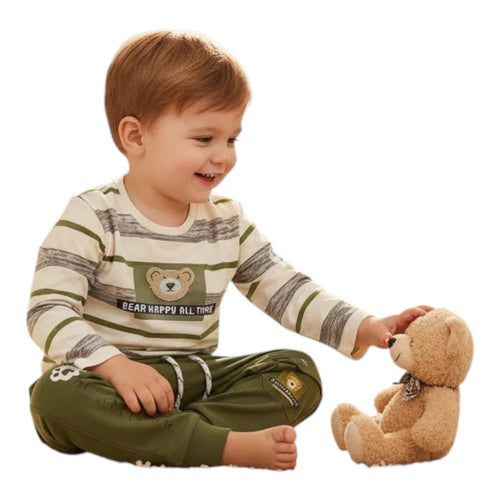 Mini & Mama striped long sleeve top with bear graphic and olive joggers. A young boy sits playing with a teddy bear.