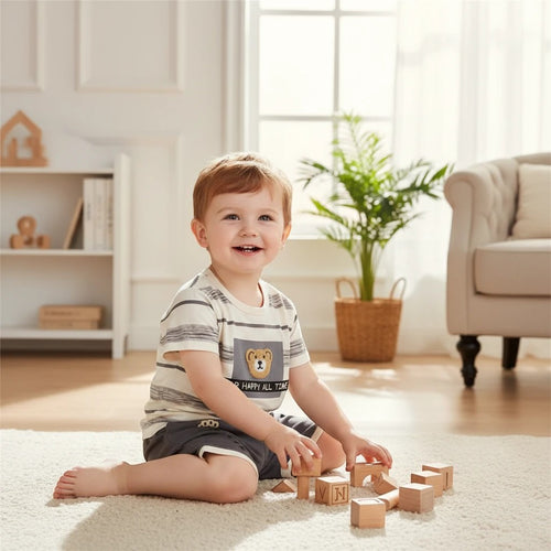 Mini & Mama boys' cream and grey striped t-shirt and shorts set with a bear graphic. Comfortable for everyday wear.