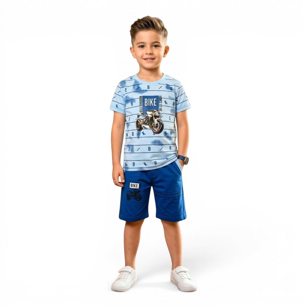 Mini & Mama boys' light blue bike print t-shirt and royal blue shorts set. T-shirt has motorcycle graphic. Shorts have elastic waistband.
