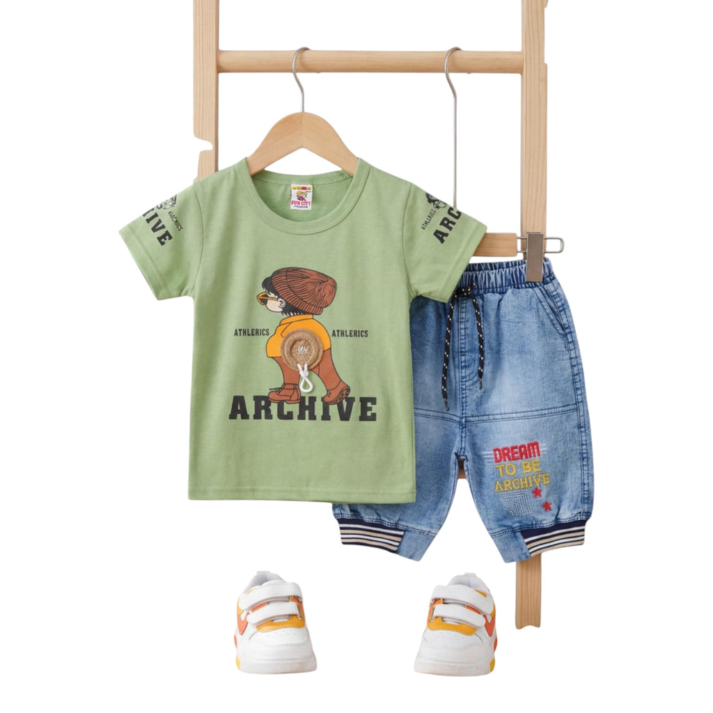Mini & Mama Boys olive green graphic t-shirt with character and "ARCHIVE" text, paired with blue denim shorts featuring drawstring waist and embroidered details.