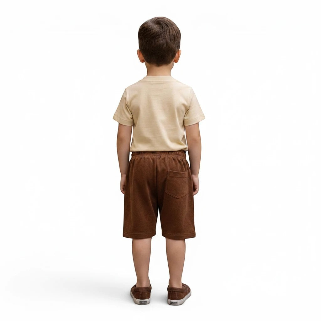 Mini & Mama boys light beige cotton graphic t-shirt and brown terry cloth shorts set.