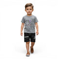 Mini & Mama boys grey graphic t-shirt and black shorts set. T-shirt has a cartoon car graphic. Shorts have an elastic waistband and drawstring.