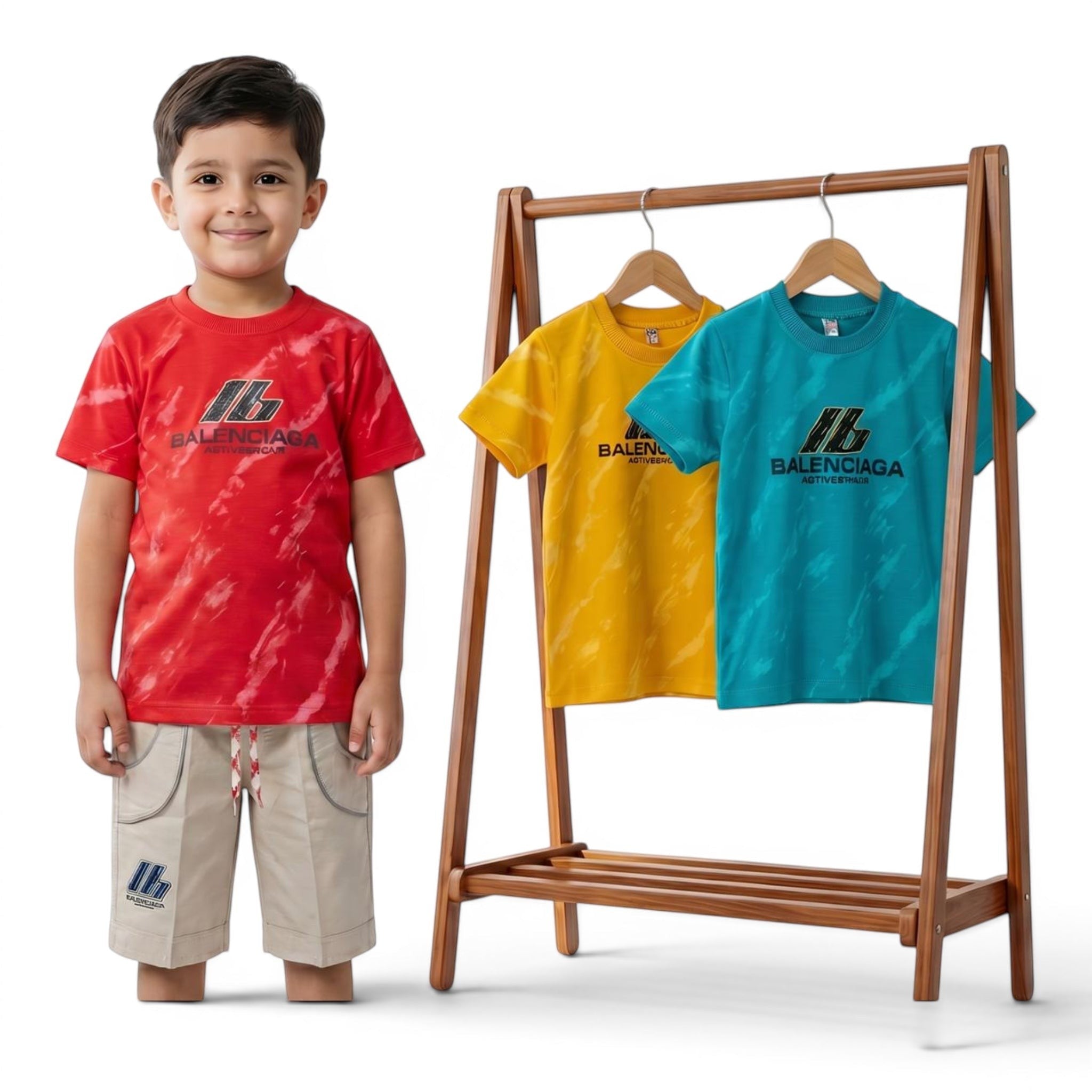 Mini & Mama Boys red tie-dye graphic t-shirt and beige shorts set. Three t-shirts on rack: red, yellow, blue.