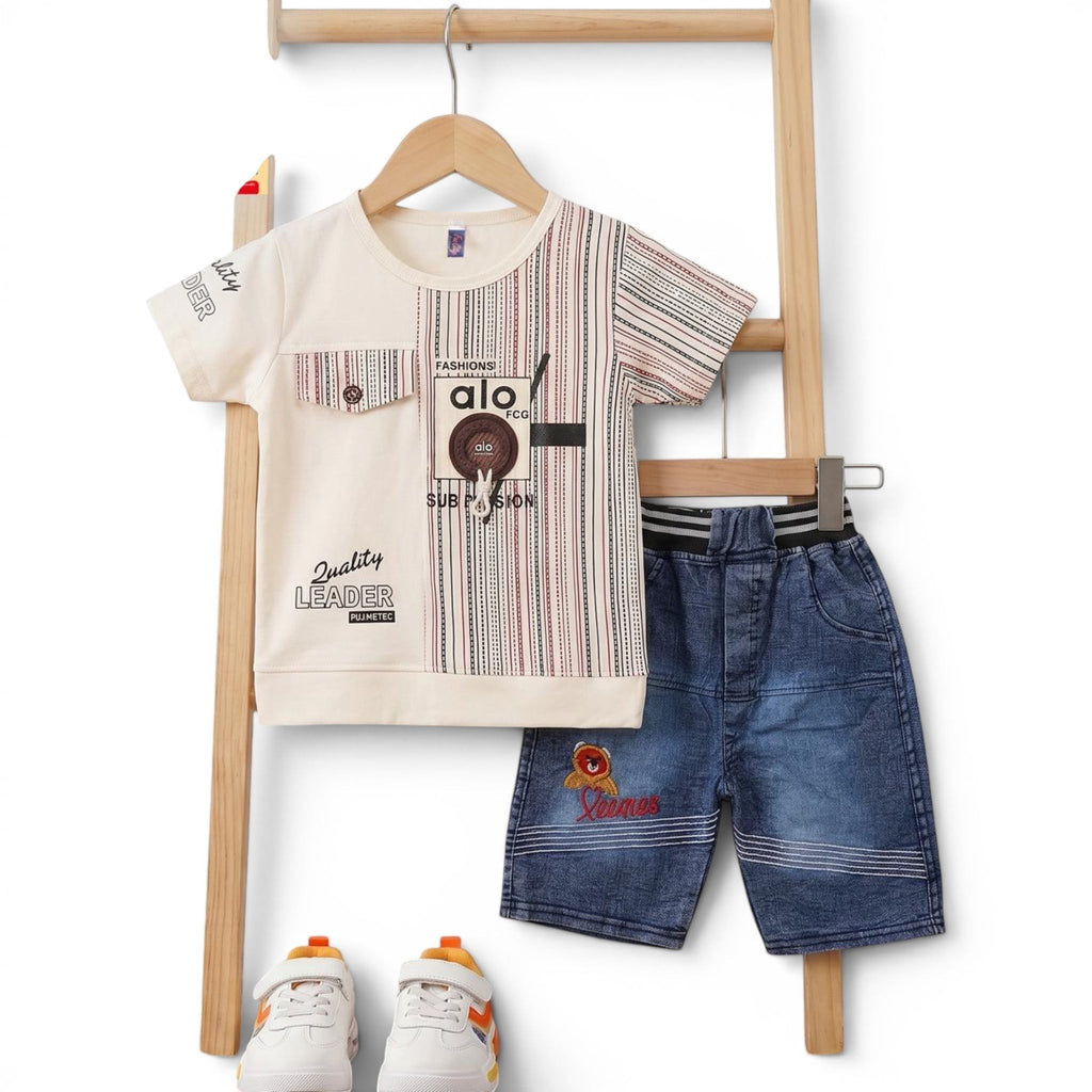 Mini & Mama Boys' cream graphic t-shirt with chest pocket and striped sleeves, paired with blue denim shorts. Cotton blend.