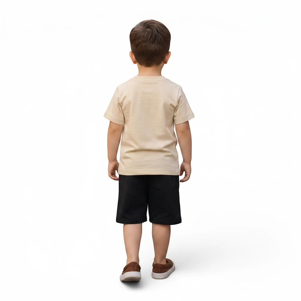 Mini & Mama boys' beige graphic t-shirt and black shorts set. Short-sleeve tee with crew neck. Shorts have elastic waistband and drawstring.