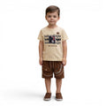 Mini & Mama boys' light beige cotton t-shirt with graphic print and brown terry cloth shorts. Features game controller graphic.