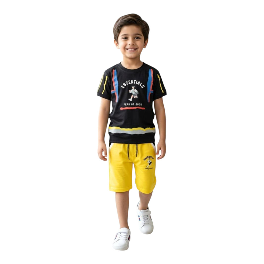 Mini & Mama boys black graphic t-shirt with colorful sleeve stripes and yellow shorts with drawstring waist.