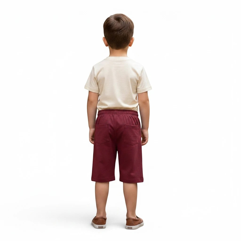 Mini & Mama Boys' cream graphic t-shirt and burgundy shorts set with elastic waistband and pockets.