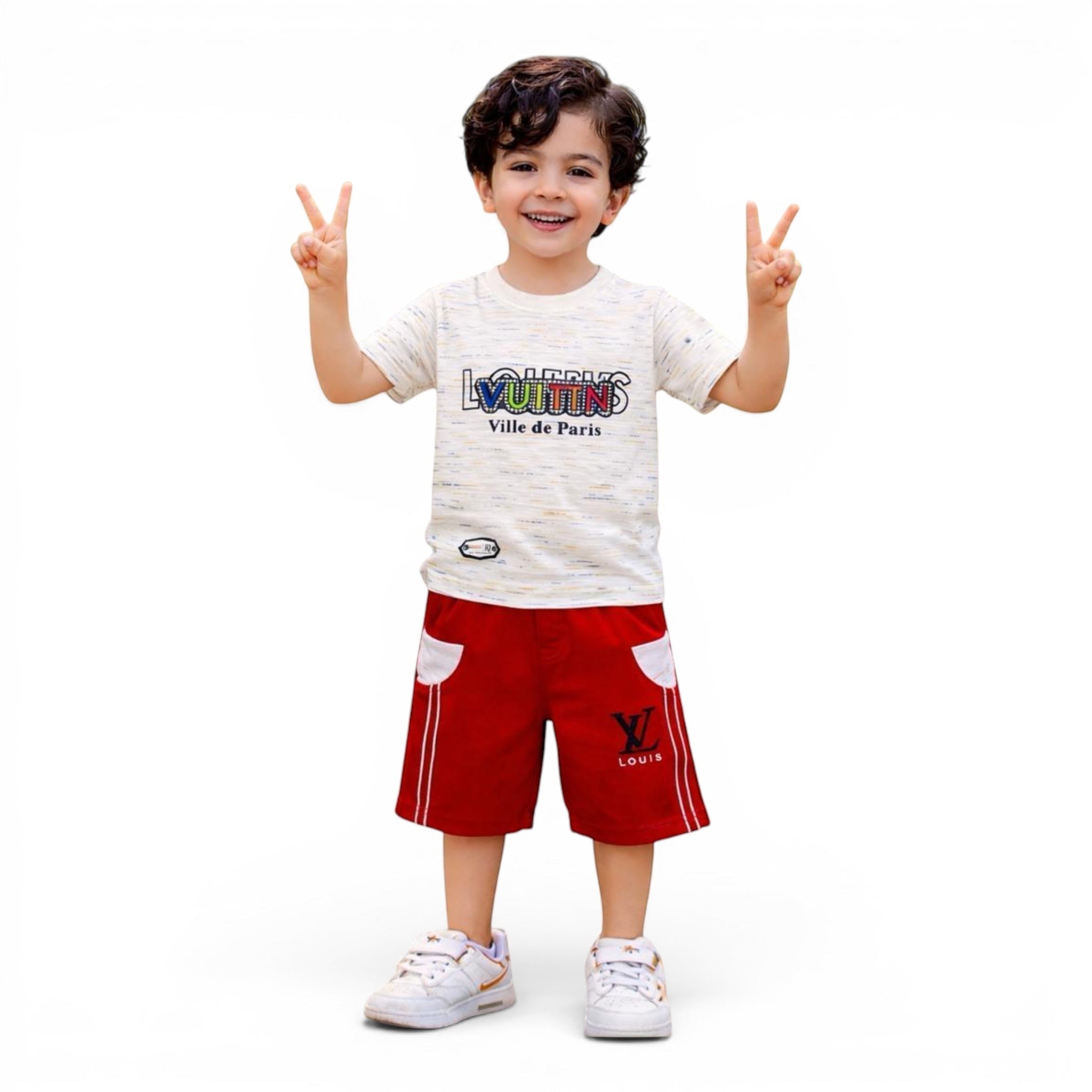 Mini & Mama Boys' cream graphic t-shirt and red shorts set with elastic waistband and white pocket accents.