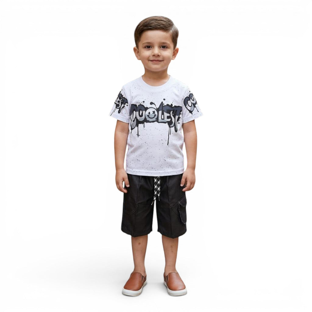 Mini & Mama boys white cotton t-shirt with black graphic print and black cargo shorts. Features smiley face detail.