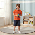 Mini & Mama Boys orange graphic print polo shirt with dark wash denim shorts. Features "CLASSIC SPORTS" and "GAME DAY" text.