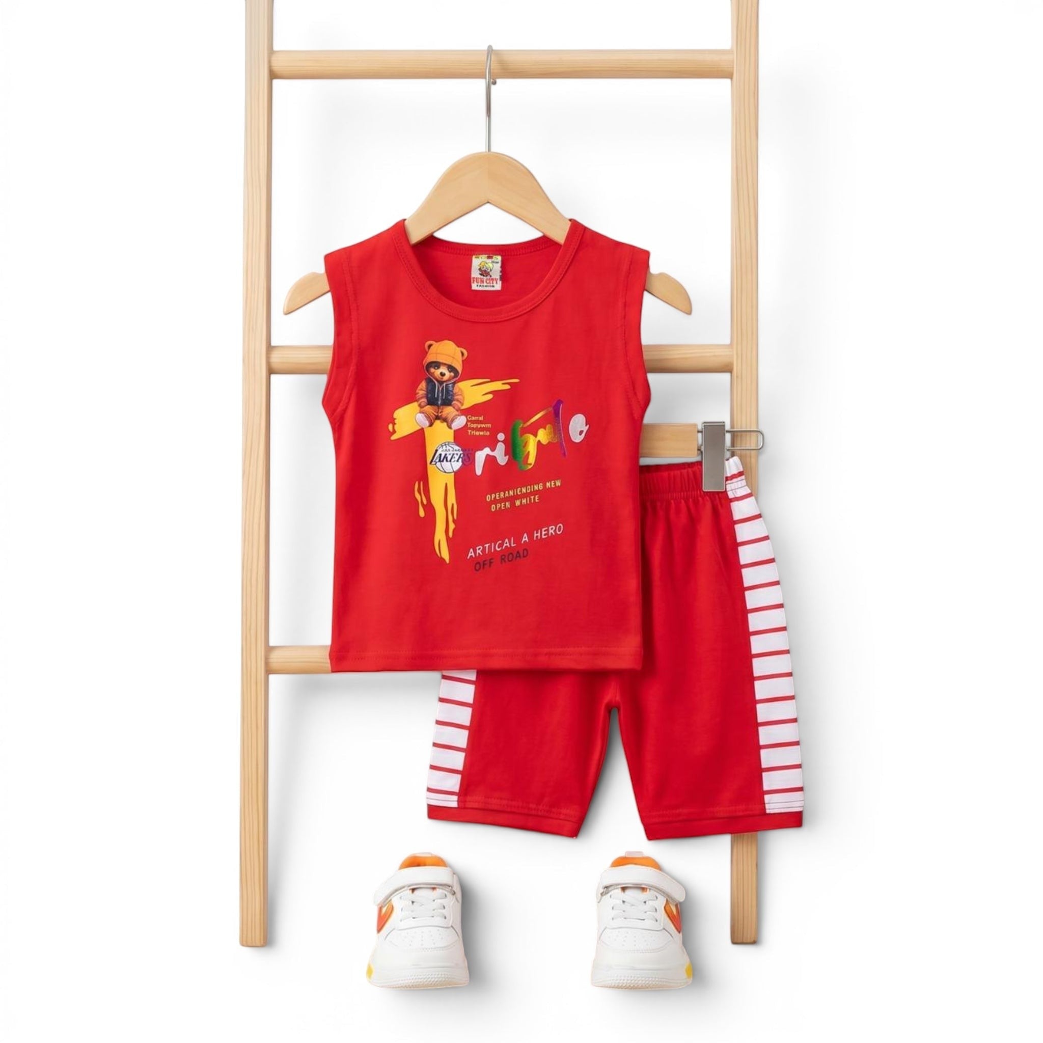Mini & Mama Boys red sleeveless t-shirt with graphic print and striped shorts set. Soft, breathable fabric.