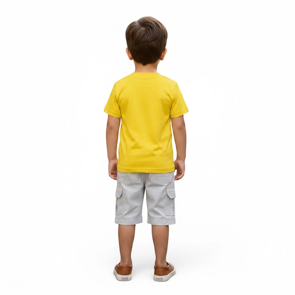 Mini & Mama Boys Spider-Man graphic t-shirt and light grey cargo shorts set. The t-shirt is yellow cotton with a graphic. The shorts have cargo pockets and a drawstring waist.