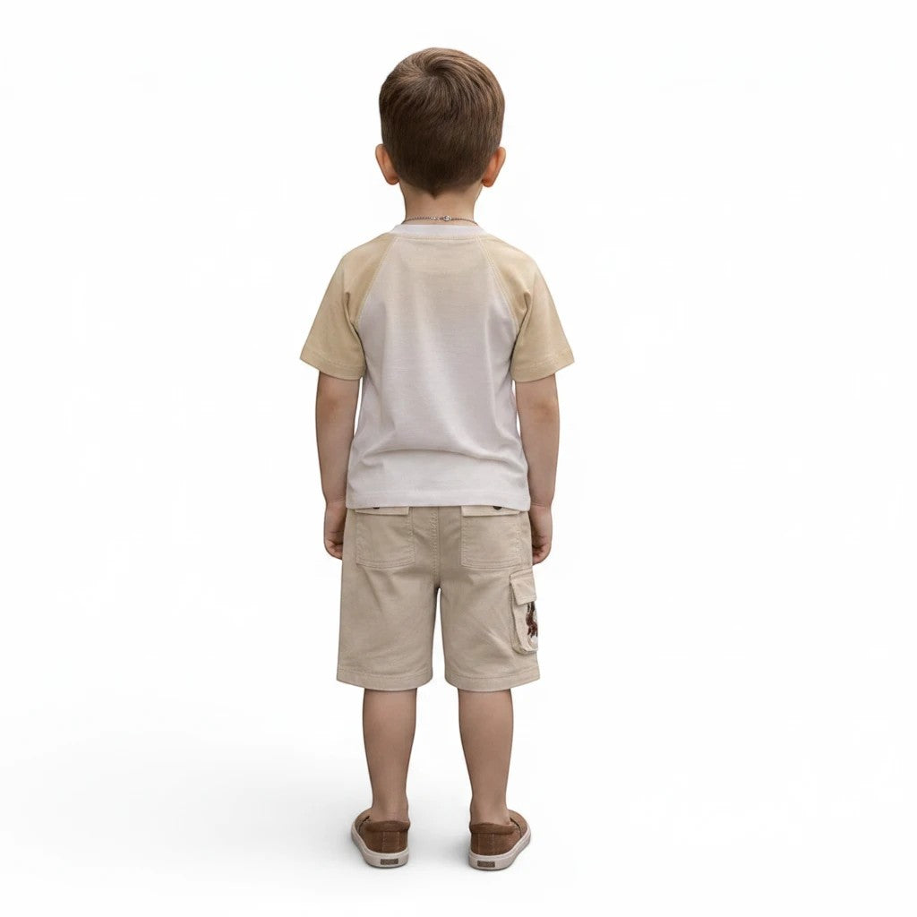 Mini & Mama Boys two-piece t-shirt and cargo shorts set in beige and white cotton. Features graphic print and multiple pockets.