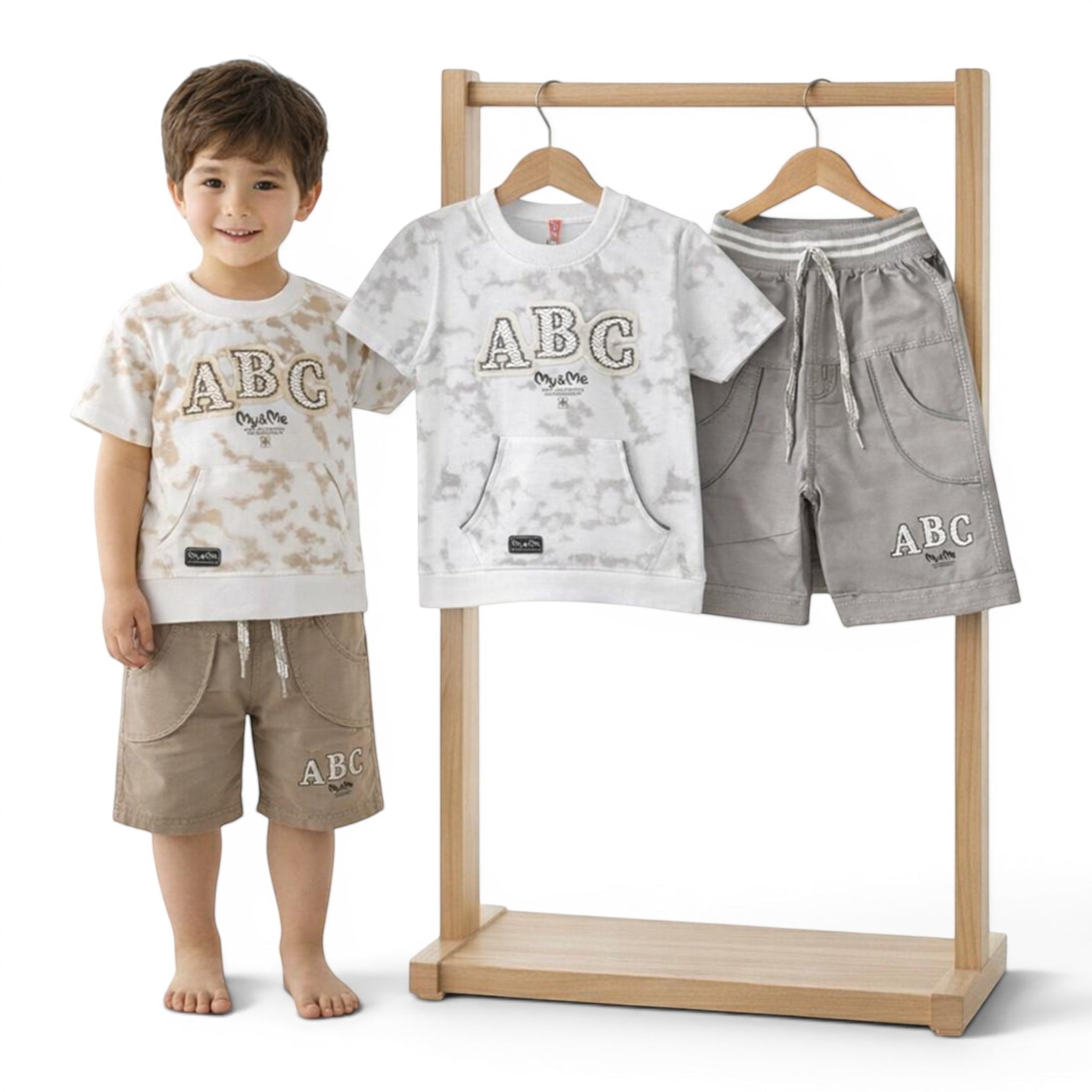 Mini & Mama boys' beige and grey tie-dye t-shirt and shorts set with ABC print. Features a front pocket and drawstring waist.