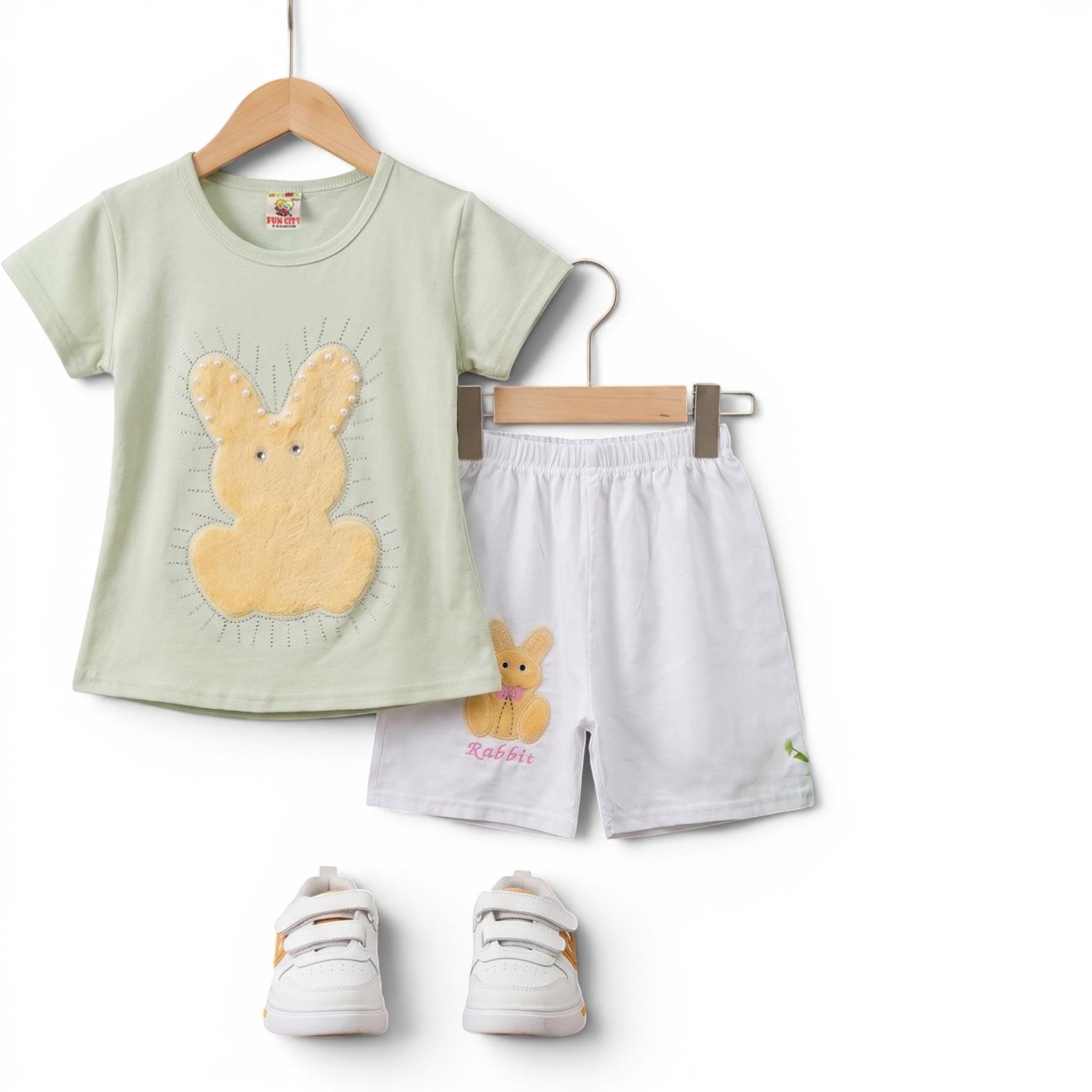 Mini & Mama light mint green cotton t-shirt with fuzzy yellow bunny applique and white shorts with bunny graphic and "Rabbit" embroidery.