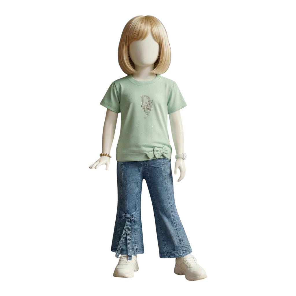 Mini & Mama light mint green graphic tee with subtle sparkle design and blue denim flare jeans with bow details for girls.