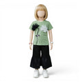 Mini & Mama light green short-sleeve top with floral embellishments and black polka dot wide-leg pants.