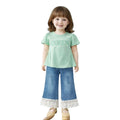 Mini & Mama Girls mint green graphic tee with puff sleeves and "QUEEN" design, paired with blue wide-leg jeans with lace trim.