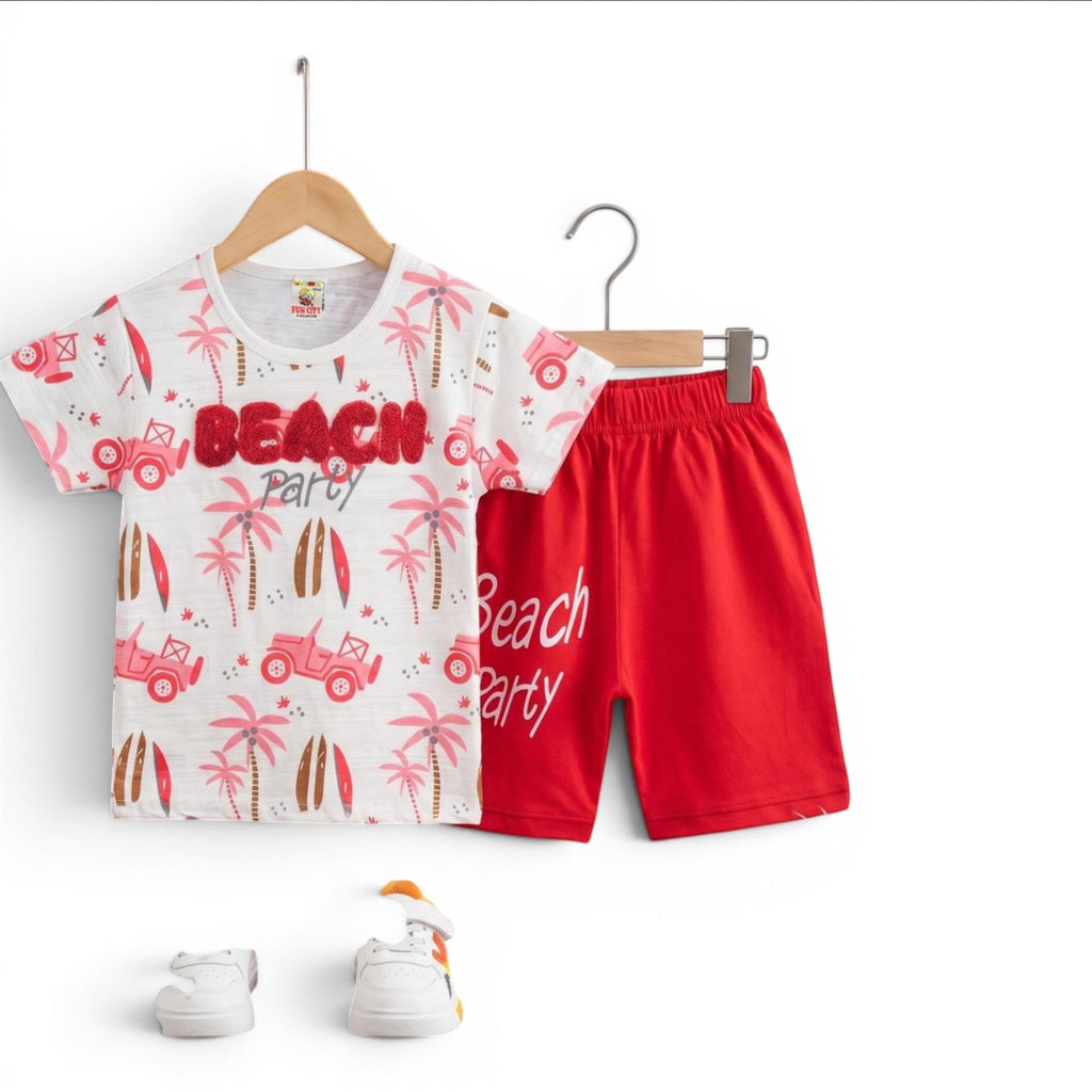 Mini & Mama white t-shirt with red shorts, featuring a beach party graphic with palm trees, surfboards, and jeeps.