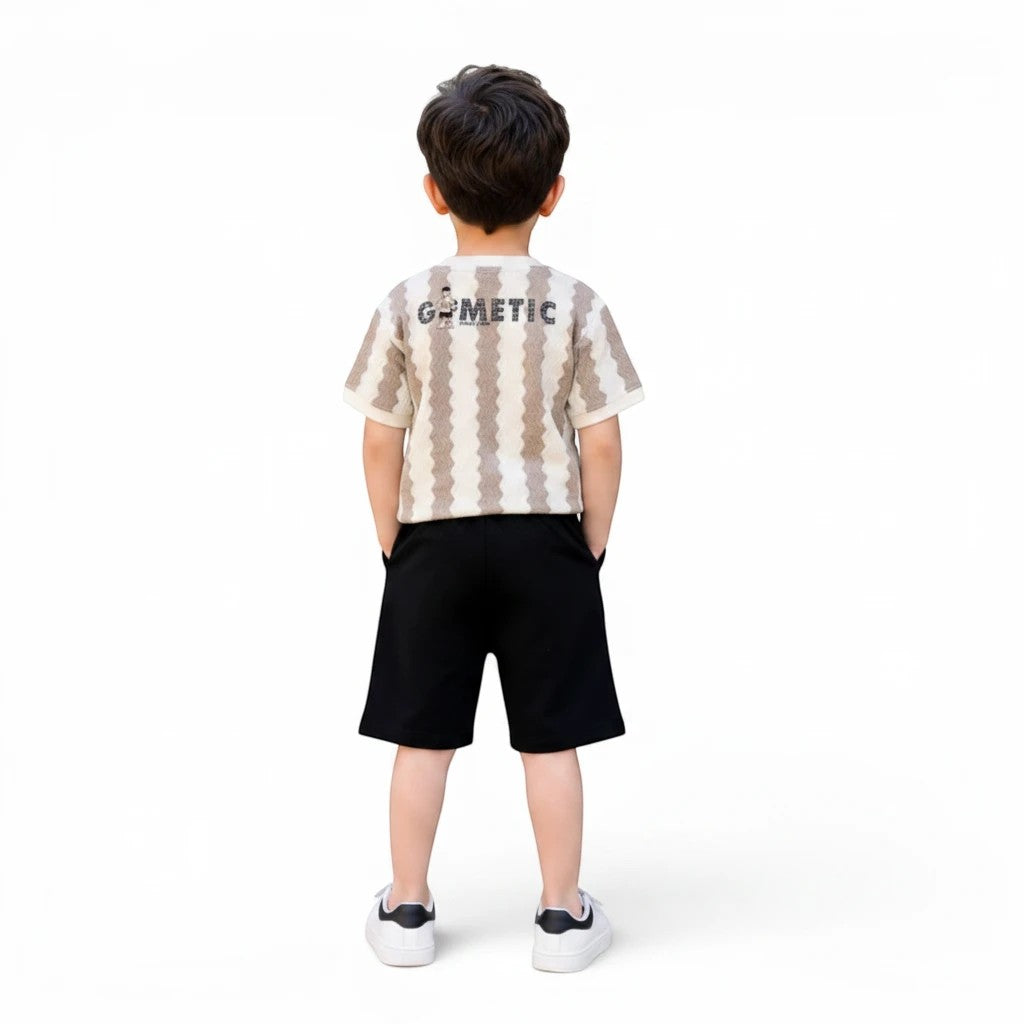 Mini & Mama Kids beige and brown geometric print t-shirt with black shorts. Short-sleeved tee with wavy stripes and text graphic.