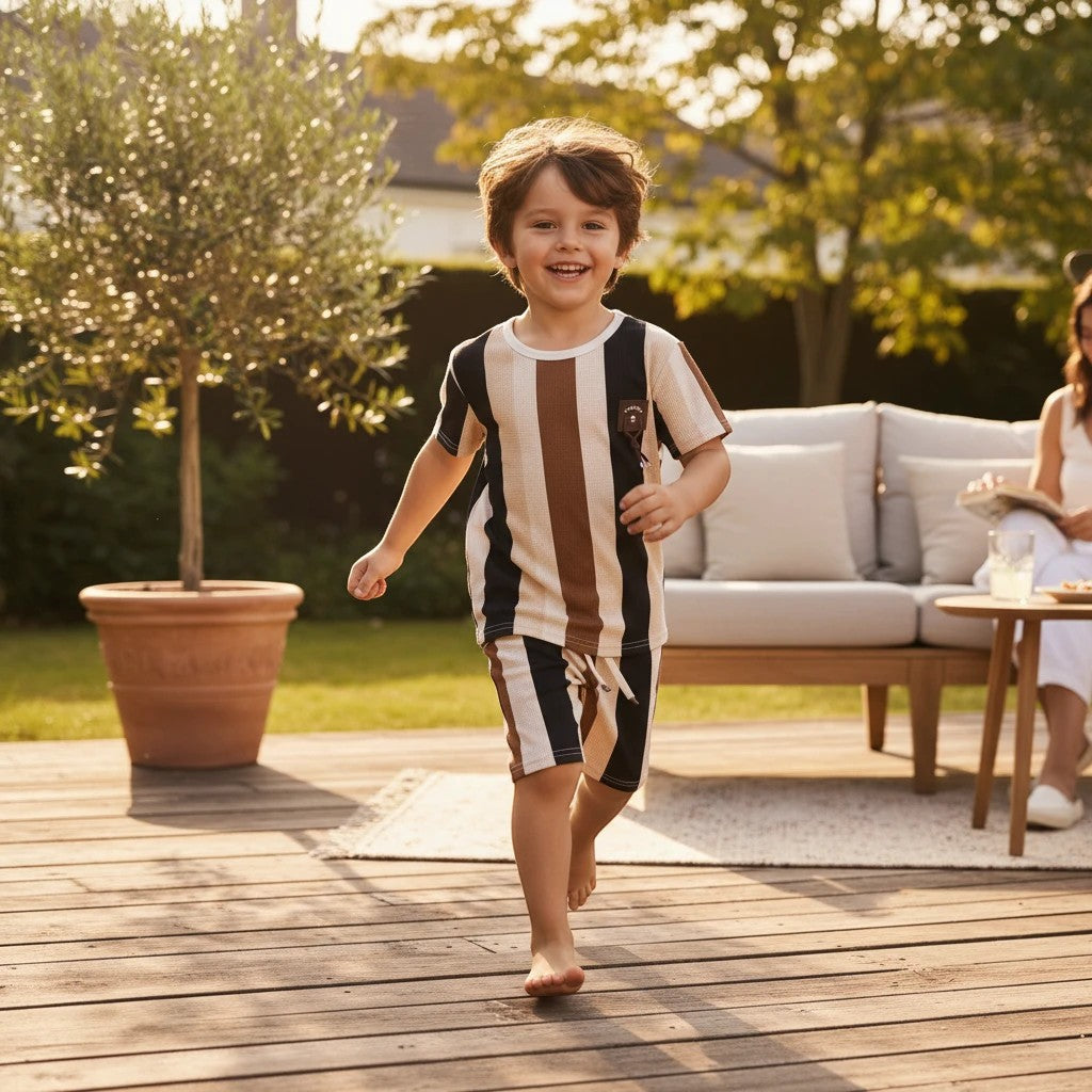 Mini & Mama kids' striped t-shirt and shorts set in brown, beige, and black. Short sleeves, crew neck, emblem detail.